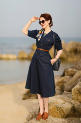 a lady in a denim top and a denim skirt